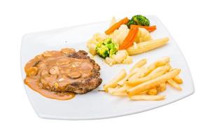 Beef steak on the plate and white background photo