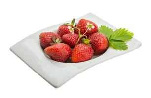 Ripe strawberry in a bowl on white background photo