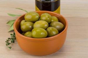 Marinated green olives photo