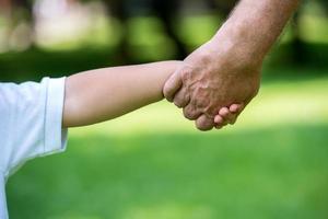 grandfather and child have fun  in park photo