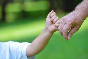 happy grandfather and child in park photo