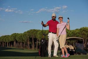 portrait of couple on golf course photo