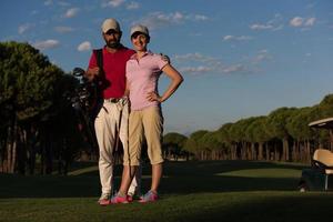 portrait of couple on golf course photo