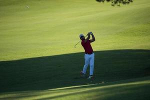 golf player hitting long shot photo