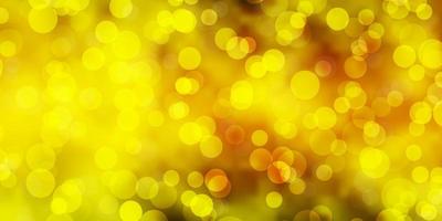 Light Green, Yellow vector background with bubbles.