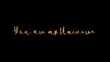 Golden text You are my universe on black background. video