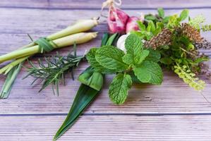 kitchen herb garden concept - Natural fresh herbs and spice on rustic wood background in the kitchen for ingredient food photo