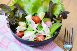 Salad vegetable - salad bowl with chicken and fresh lettuce tomato cucumber healthy food eating concept photo