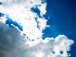 Blue sky background with clouds photo