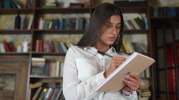 Business woman taking notes video