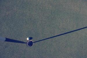 top view of golf ball in the hole photo