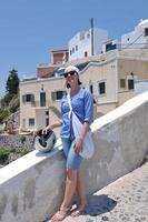 Greek woman on the streets of Oia, Santorini, Greece photo