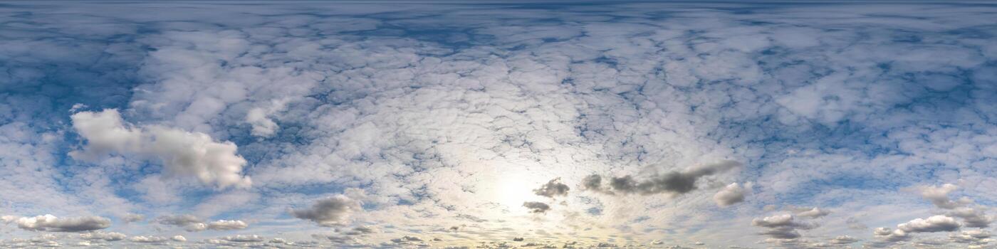 blue sky hdr 360 panorama with white beautiful clouds in seamless projection with zenith for use in 3d graphics or game development as sky dome or edit drone shot for sky replacement photo