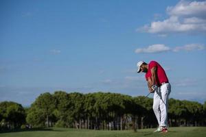 golf player hitting long shot photo