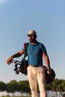 golfer  portrait at golf course on sunset photo