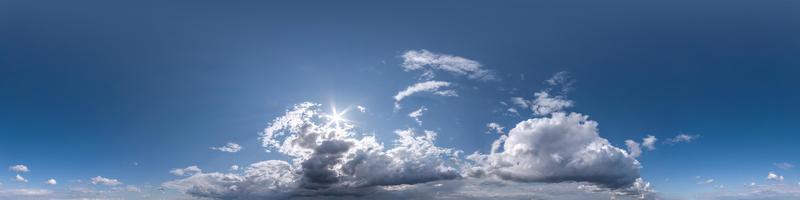 blue sky hdri 360 panorama with white beautiful clouds in seamless projection with zenith for use in 3d graphics or game development as sky dome or edit drone shot for sky replacement photo