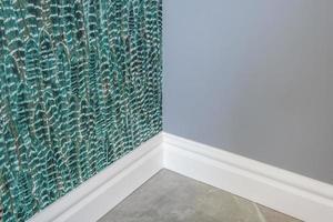 Detail of corner flooring with intricate crown molding and plinth. photo