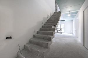 empty white room with concrete stair without repair and furniture photo