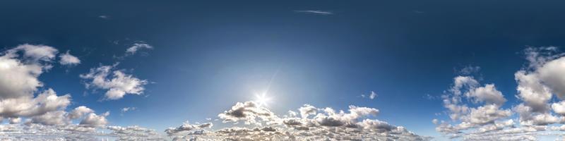 Seamless hdri panorama 360 degrees angle view blue sky with beautiful cumulus clouds with zenith for use in 3d graphics or game development as sky dome or edit drone shot photo