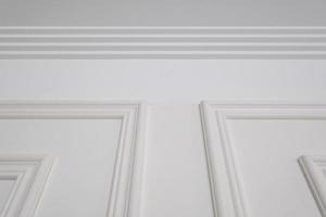 Detail of corner ceiling with intricate crown molding. photo