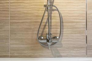 water tap sink with faucet in expensive bathroom with wall mount shower attachment photo