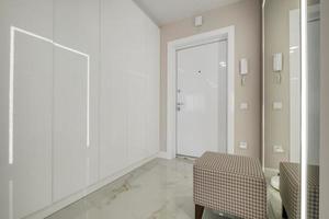 long empty corridor in interior of entrance hall of modern apartments, office or clinic photo