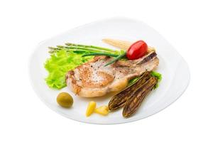 T-bone steak on the plate and white background photo