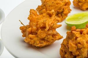 Onion bhajee on the plate photo