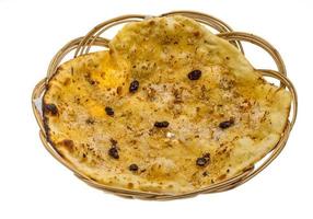 Pishwary naan in a basket on white background photo