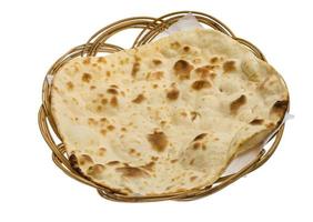 Plain Naan in a basket on white background photo