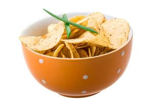 Potato chips in a bowl on white background photo