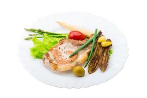 T-bone steak on the plate and white background photo