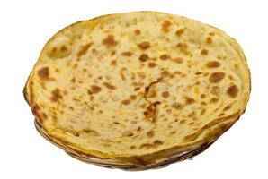 Alu Naan in a basket on white background photo