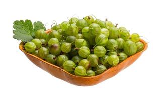 Gooseberry in a bowl on white background photo