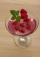Raspberry gelly on wooden background photo