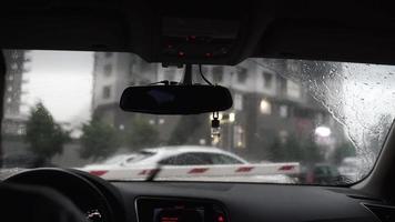 Passenger view of car navigating traffic on a rainy day video