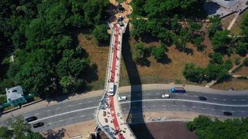 Aerial view of Kyiv pedestrian bridge over street traffic video