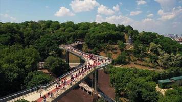 Aerial view of Kyiv pedestrian bridge over street traffic and view of city of Kyiv Ukraine video