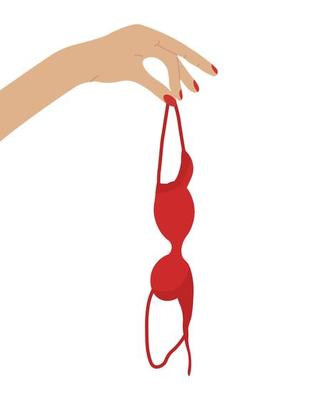 Hand holding red bra in consept of breast awareness. Brassiere