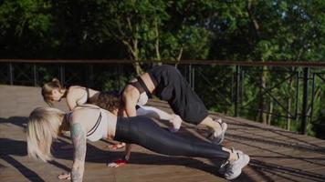 Women group workout outdoors video