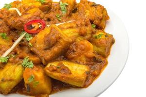 Alu Bengan on the plate and white background photo