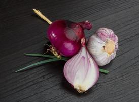 Red onion on wooden background photo