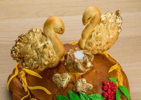 Karavay - Russian traditional bread on wooden background photo