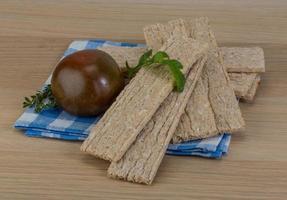 Stack of crispbread on tartan napkin photo