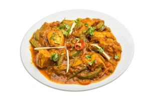 Chicken Jhalfrazi on the plate and white background photo