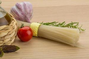 Rice noodle on wooden background photo