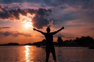 Feeling free at summer sunset photo