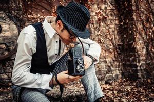 Photographer looking through visor of medium format camera. photo