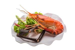 Giant Freshwater Prawn on the plate and white background photo