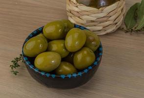 Marinated green olives photo